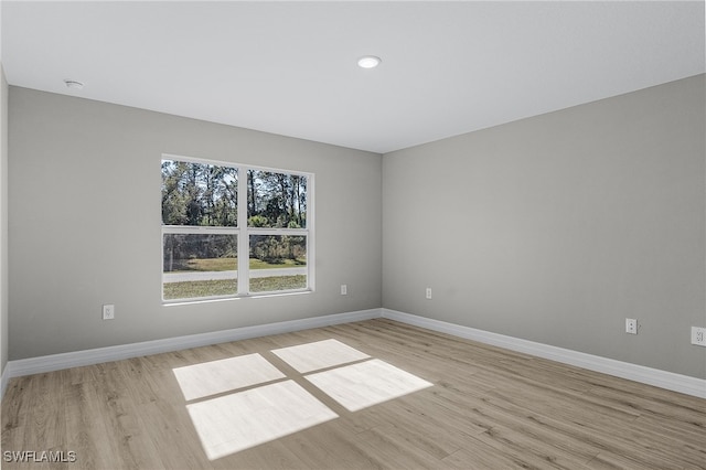 spare room with light wood-type flooring