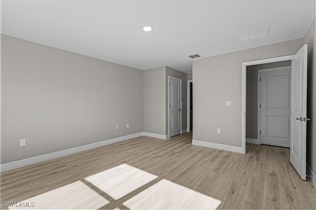 unfurnished bedroom featuring light wood-type flooring