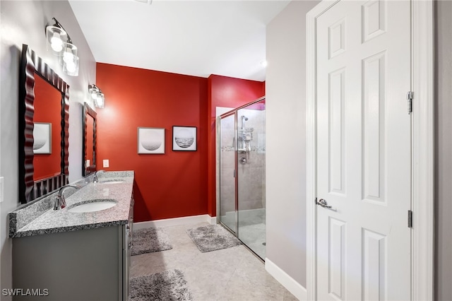 bathroom featuring walk in shower and vanity