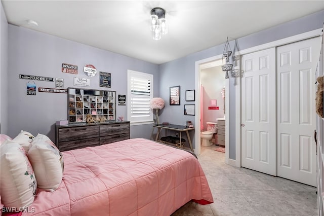 bedroom featuring a closet and ensuite bathroom