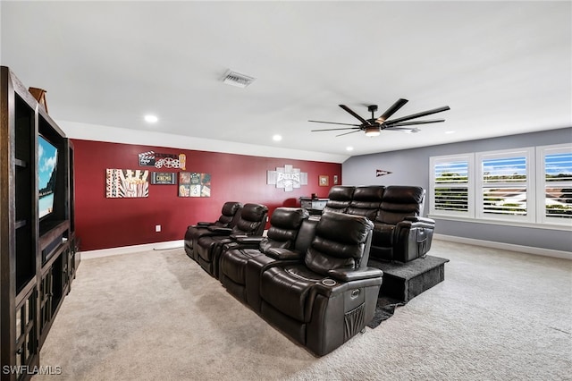 cinema room with carpet flooring and ceiling fan