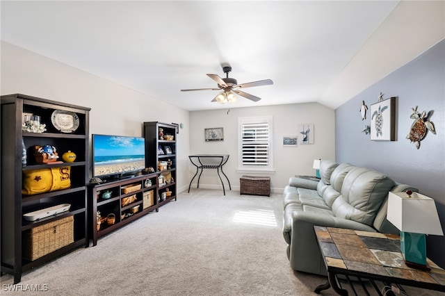 living room featuring carpet floors, vaulted ceiling, and ceiling fan