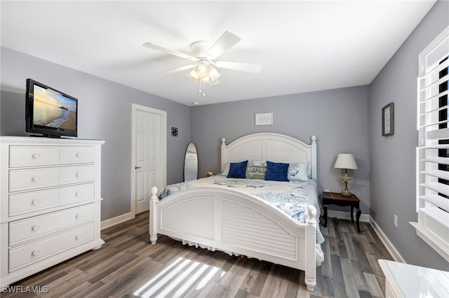 bedroom with ceiling fan and dark hardwood / wood-style flooring