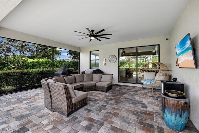 exterior space with an outdoor living space and ceiling fan