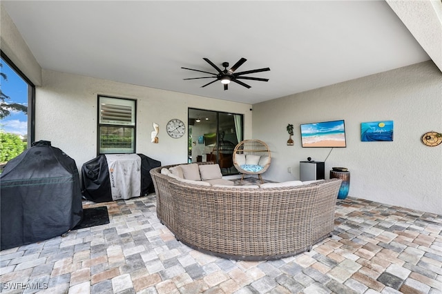 view of patio with ceiling fan, outdoor lounge area, and area for grilling