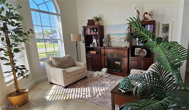 living area featuring a wealth of natural light and light tile patterned floors