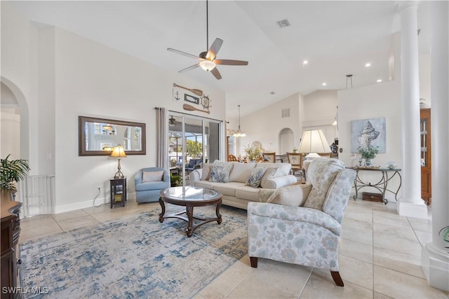 tiled living room featuring ceiling fan and high vaulted ceiling