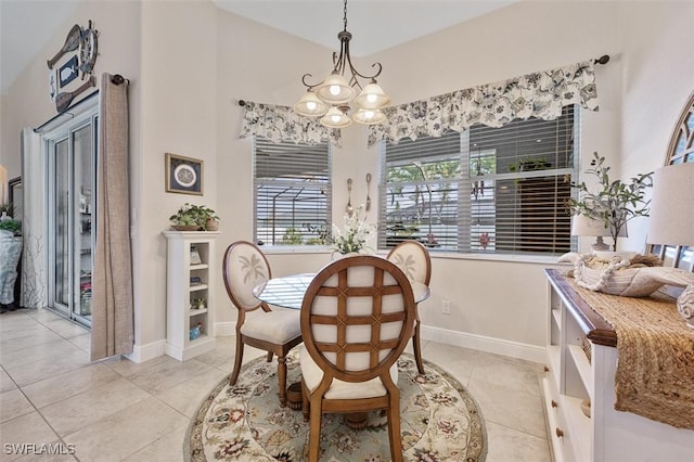 tiled dining space featuring a chandelier