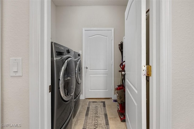 laundry room with separate washer and dryer