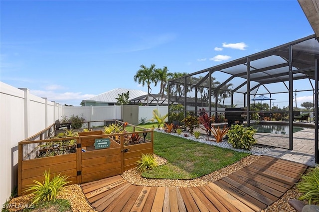 deck with a fenced in pool, a yard, and glass enclosure