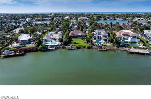 birds eye view of property featuring a water view