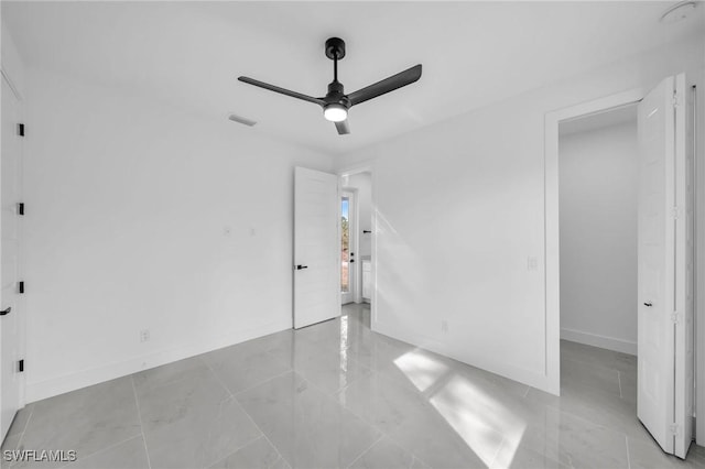 unfurnished bedroom featuring ceiling fan