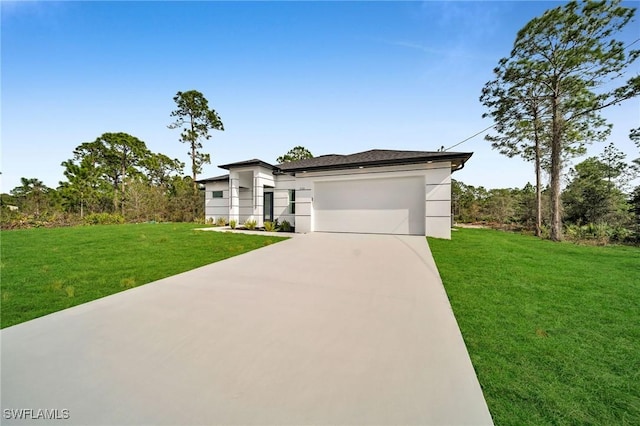 view of front facade featuring a garage and a front yard