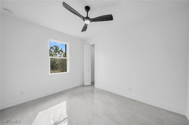 unfurnished room with ceiling fan