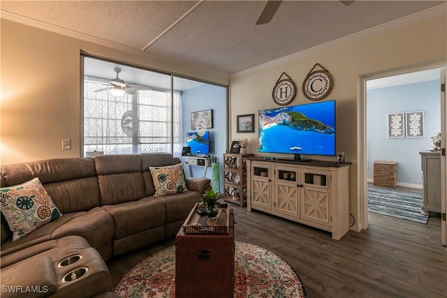 living room with ceiling fan, crown molding, dark wood-type flooring, and a textured ceiling