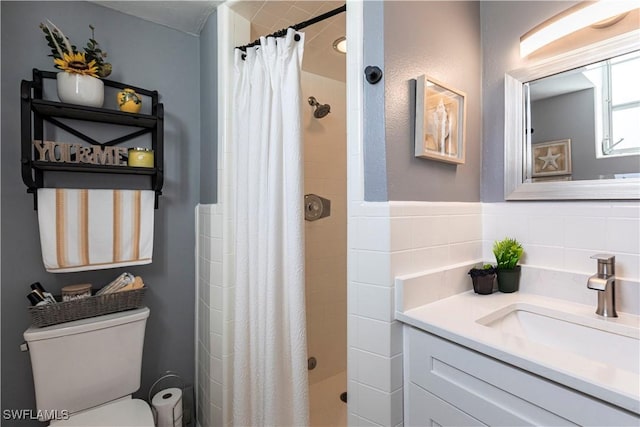 bathroom with walk in shower, vanity, toilet, and tile walls