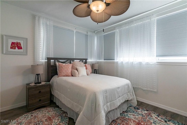 bedroom with hardwood / wood-style flooring and ceiling fan