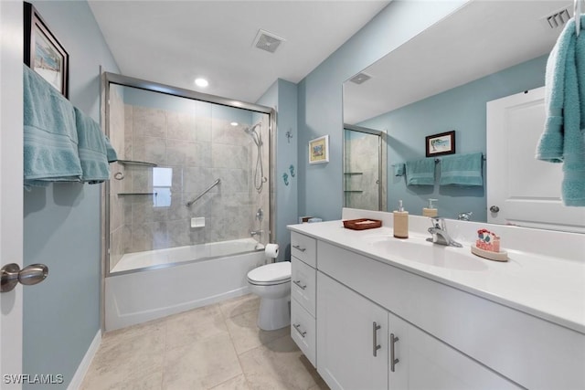 full bathroom featuring vanity, tile patterned floors, enclosed tub / shower combo, and toilet