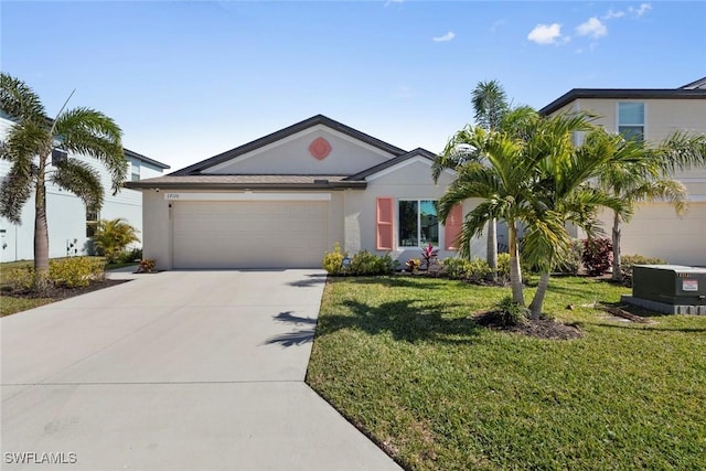 view of front of home featuring a garage and a front lawn