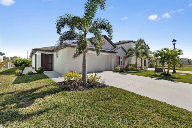 view of front of house featuring a garage and a front yard