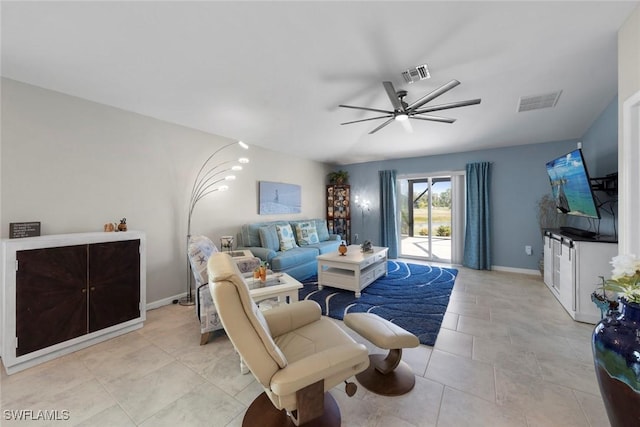 tiled living room with ceiling fan