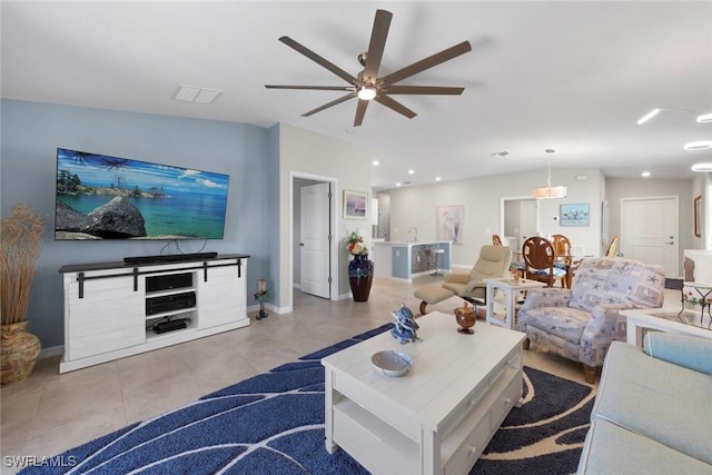 tiled living room featuring ceiling fan and lofted ceiling