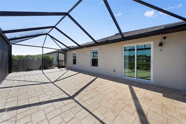 view of patio with a lanai