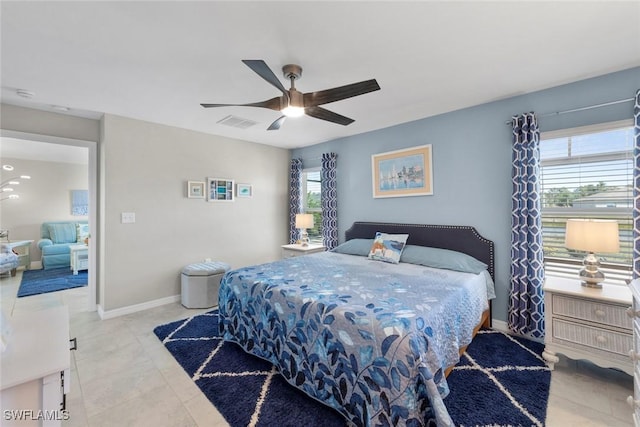 tiled bedroom with ceiling fan