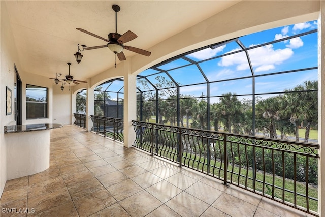 view of patio with a lanai and ceiling fan