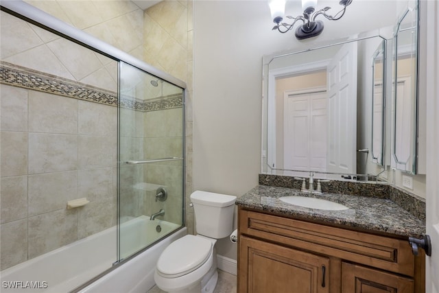 full bathroom with vanity, a notable chandelier, shower / bath combination with glass door, and toilet