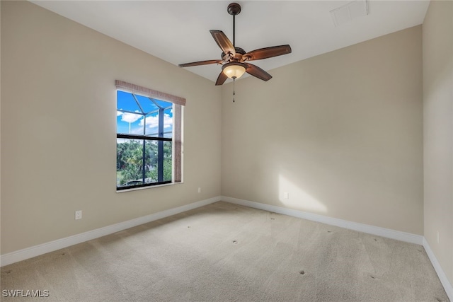 carpeted empty room with ceiling fan