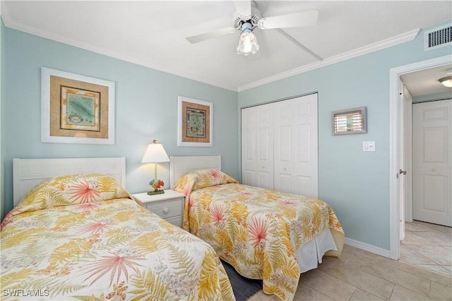 bedroom with light tile patterned flooring, ceiling fan, ornamental molding, and a closet