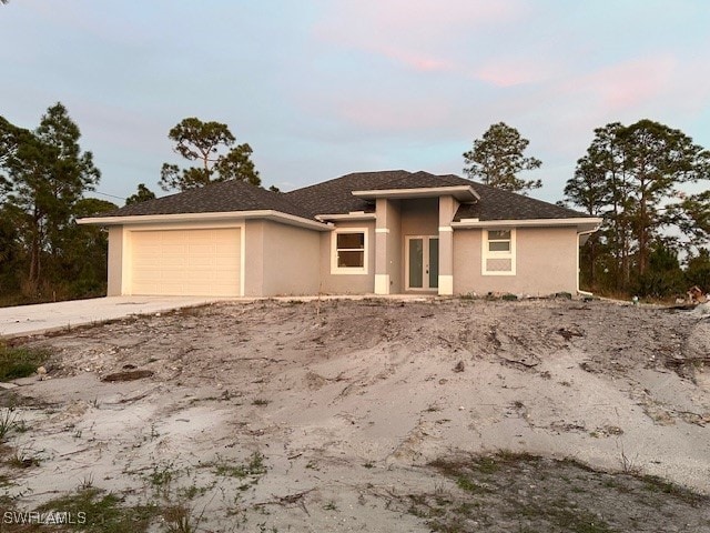 view of front of property featuring a garage