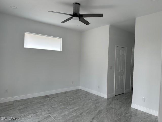 spare room with ceiling fan