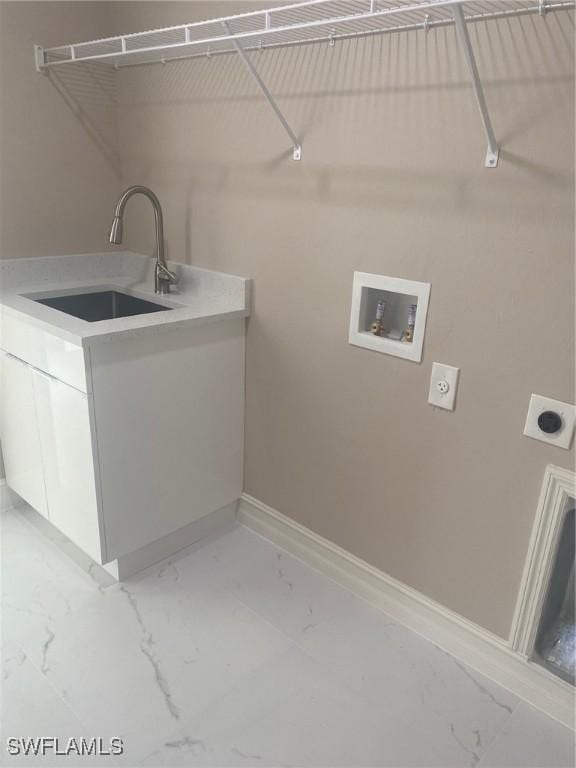 laundry room with sink, hookup for a washing machine, cabinets, and hookup for an electric dryer