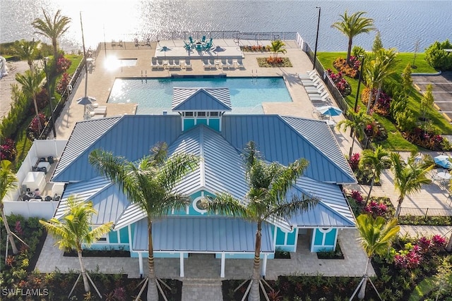 birds eye view of property with a water view