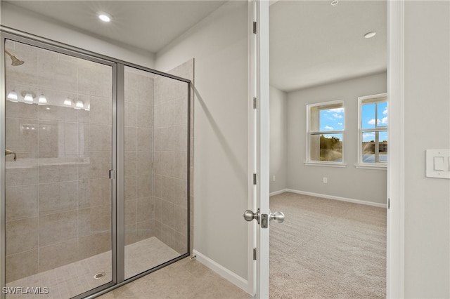 bathroom featuring recessed lighting, baseboards, and a stall shower