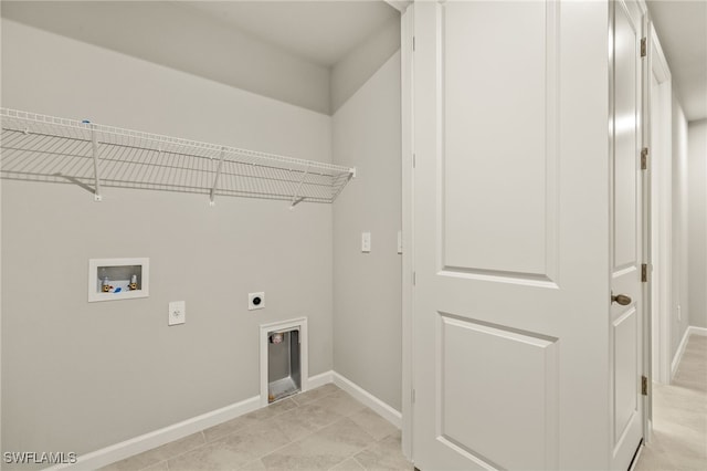 laundry room with laundry area, hookup for a washing machine, electric dryer hookup, and baseboards