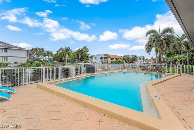 view of swimming pool with a patio