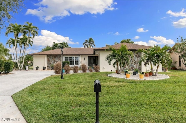 single story home with a front yard