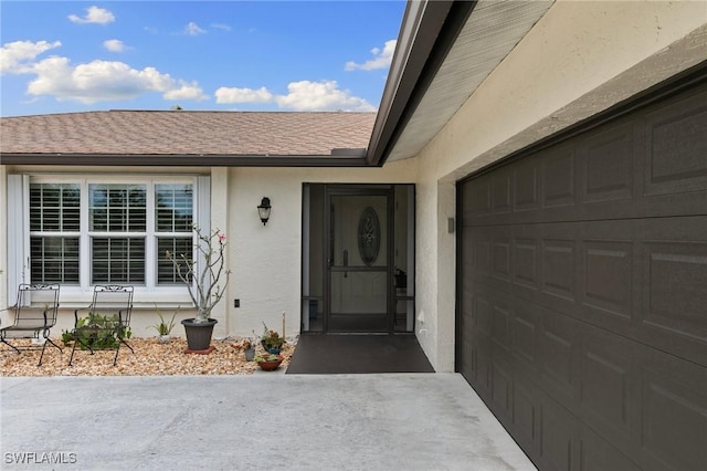 property entrance with a garage