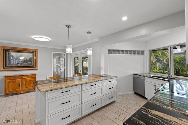 kitchen with a kitchen island, white cabinetry, hanging light fixtures, stainless steel dishwasher, and light stone countertops