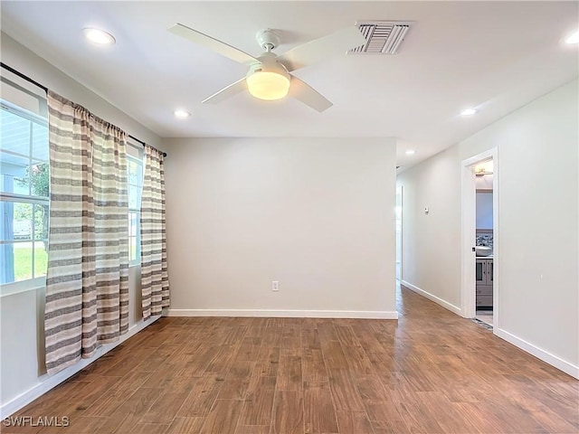 unfurnished room featuring ceiling fan and hardwood / wood-style floors