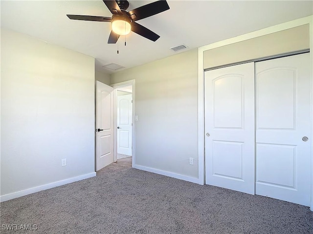 unfurnished bedroom featuring ceiling fan, a closet, and carpet floors