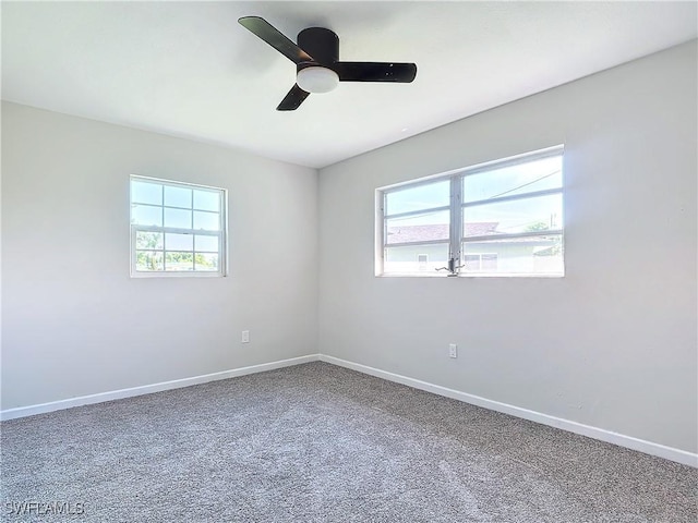 spare room with ceiling fan and carpet floors