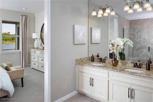 bathroom featuring vanity, tile patterned flooring, and an enclosed shower