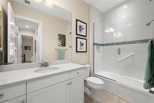 full bathroom with toilet, vanity, and enclosed tub / shower combo