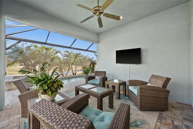 view of patio / terrace with ceiling fan and glass enclosure