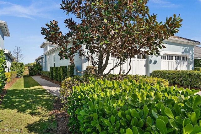 view of property exterior featuring a yard