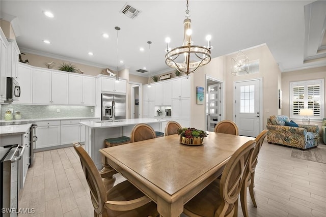 dining room with beverage cooler and crown molding